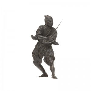 A bronze figure of samurai holding a sward