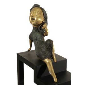 Gold gilt bronze of a lady talking on the phone 