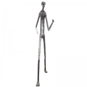 Wooden carving of a standing skinny man