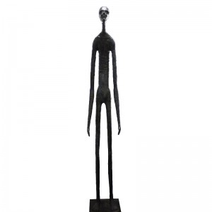Wooden carving of a standing skinny man