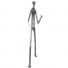 Wooden carving of a standing skinny man