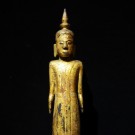 A Laotian wooden standing Buddha