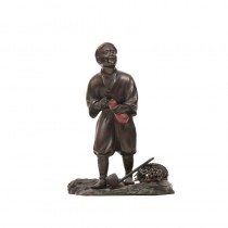 A bronze standing woodsman with gourd and axe