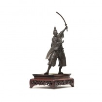A Brozne standing samurai with his sward