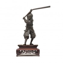 A Japanese bronze warrior wielding a long kanabo