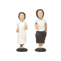 A PAIR OF WOODEN GIRLS WITH PAINTED PLACK AND WHITE