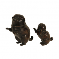 A pair of Japanese Bronze puppies