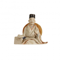 A Japanese porcelain seated scholar