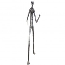 Wooden carving of a standing skinny man