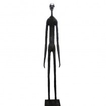 Wooden carving of a standing skinny man