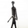Wooden carving of a standing skinny man