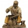 Plaster figure of a shoe repairer