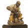 Plaster figure of a shoe repairer
