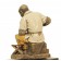 Plaster figure of a shoe repairer