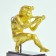 Gold gilted bronze of a boy blowing a flute