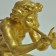 Gold gilted bronze of a boy blowing a flute