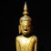 A Laotian wooden standing Buddha